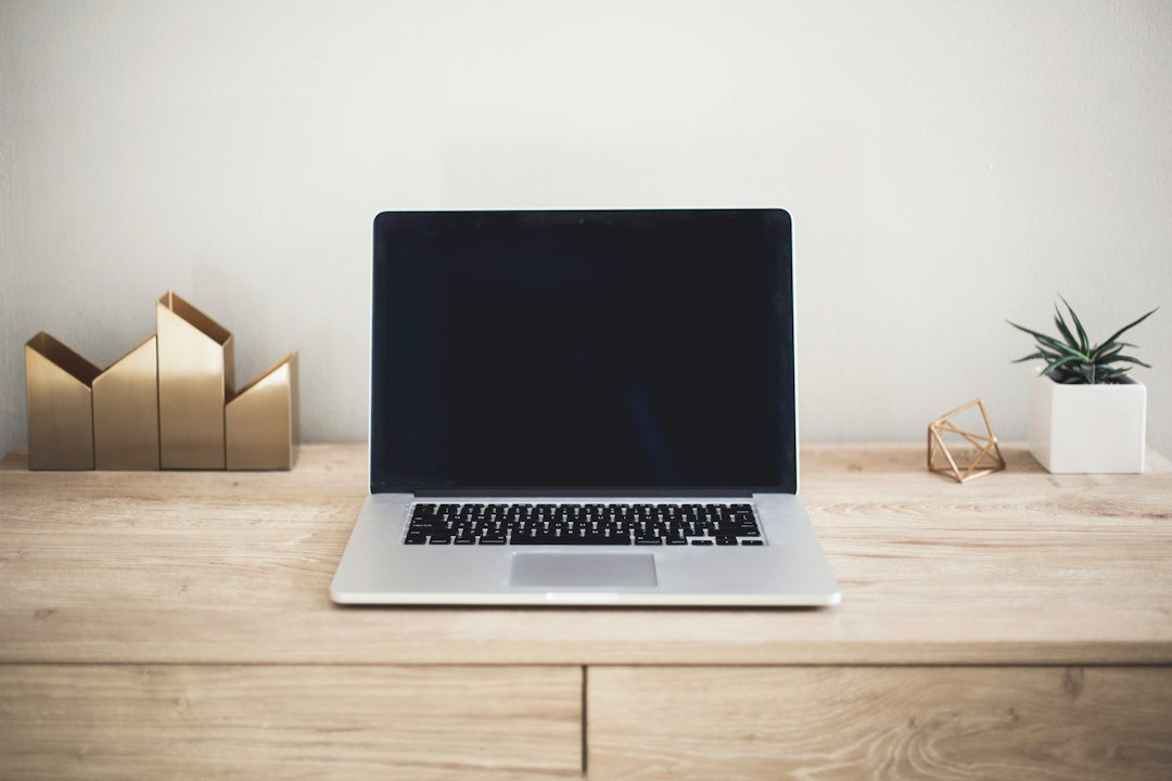 A laptop on a desk used to review a website